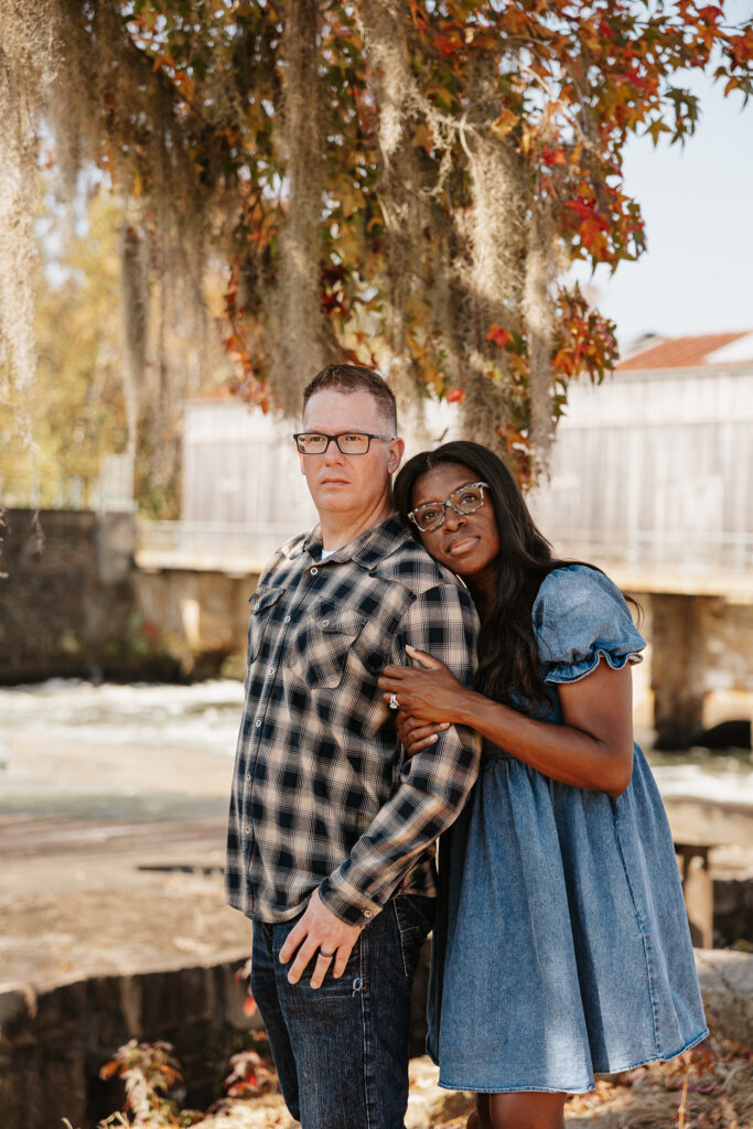Couples engagement session in front of the dam at Savannah Rapids